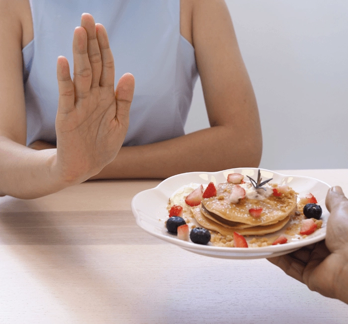 Woman considering a balanced meal choice