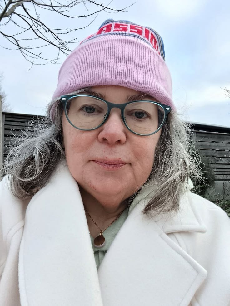 Mature woman outdoors in cool weather