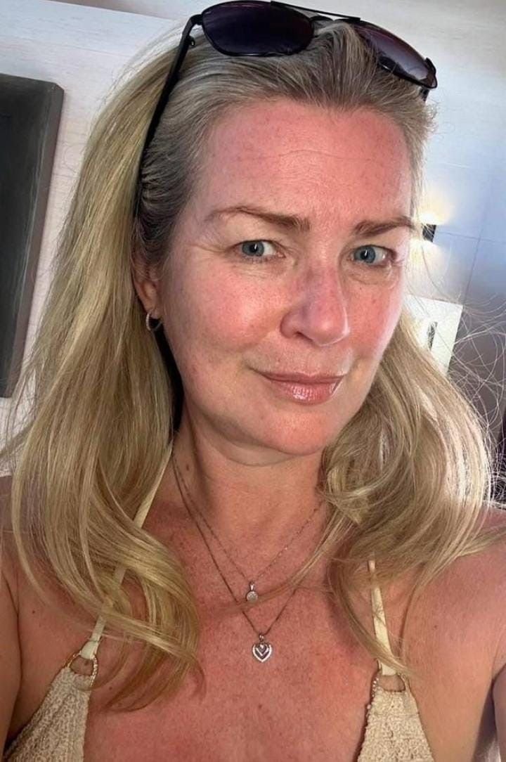 Mature woman with styled blonde hair